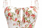 White strap top with a pink and green floral print, featuring a sweetheart neckline with a front tie closure.