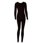 Black jumpsuit on a clear mannequin with a white background